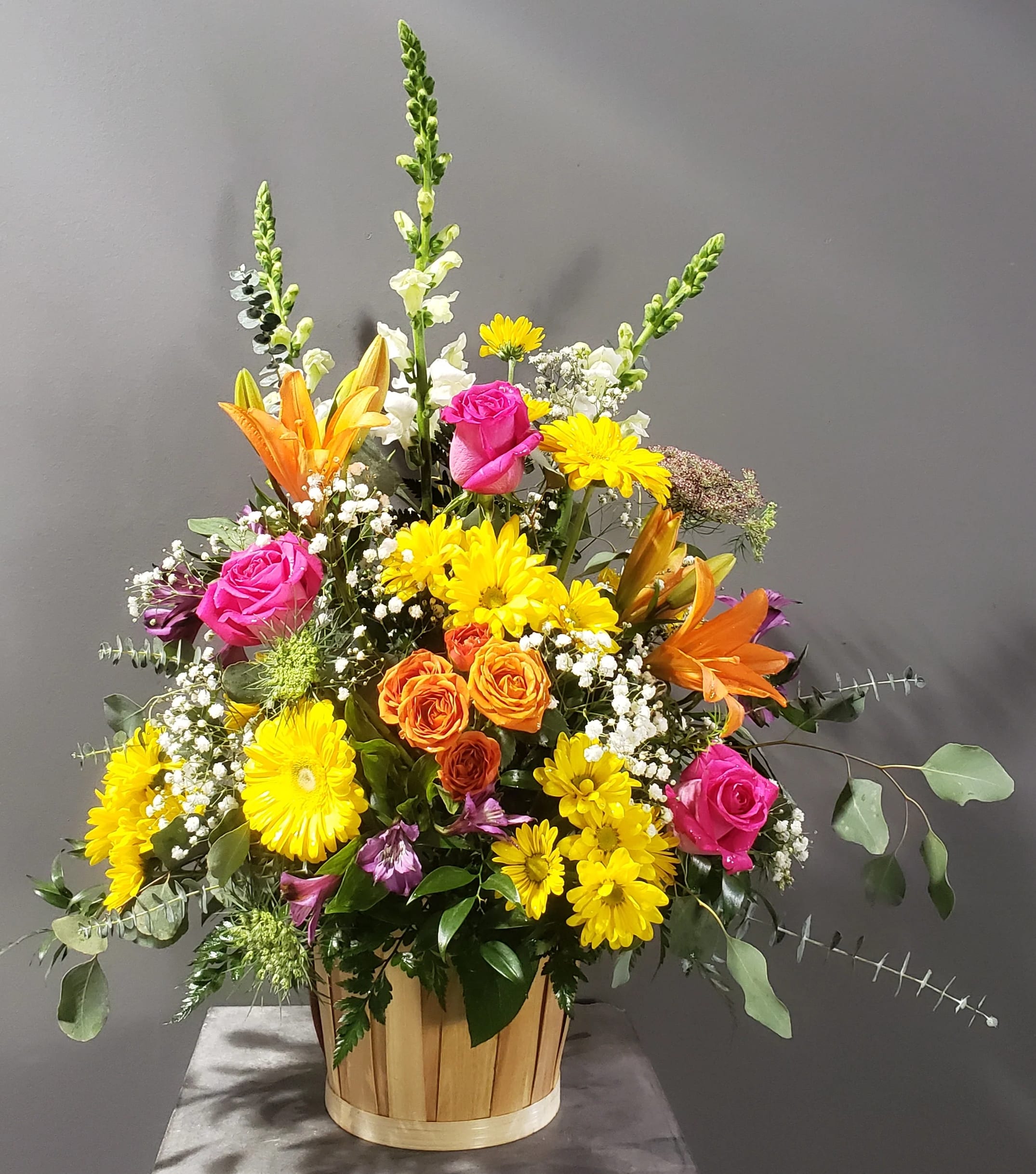 Sympathy Garden Basket - A basket of Snapdragons, Queen Ann's Lace, Daisies, Roses, Lilies, Austromeria, Salal, Leather leaf, Gerbera 