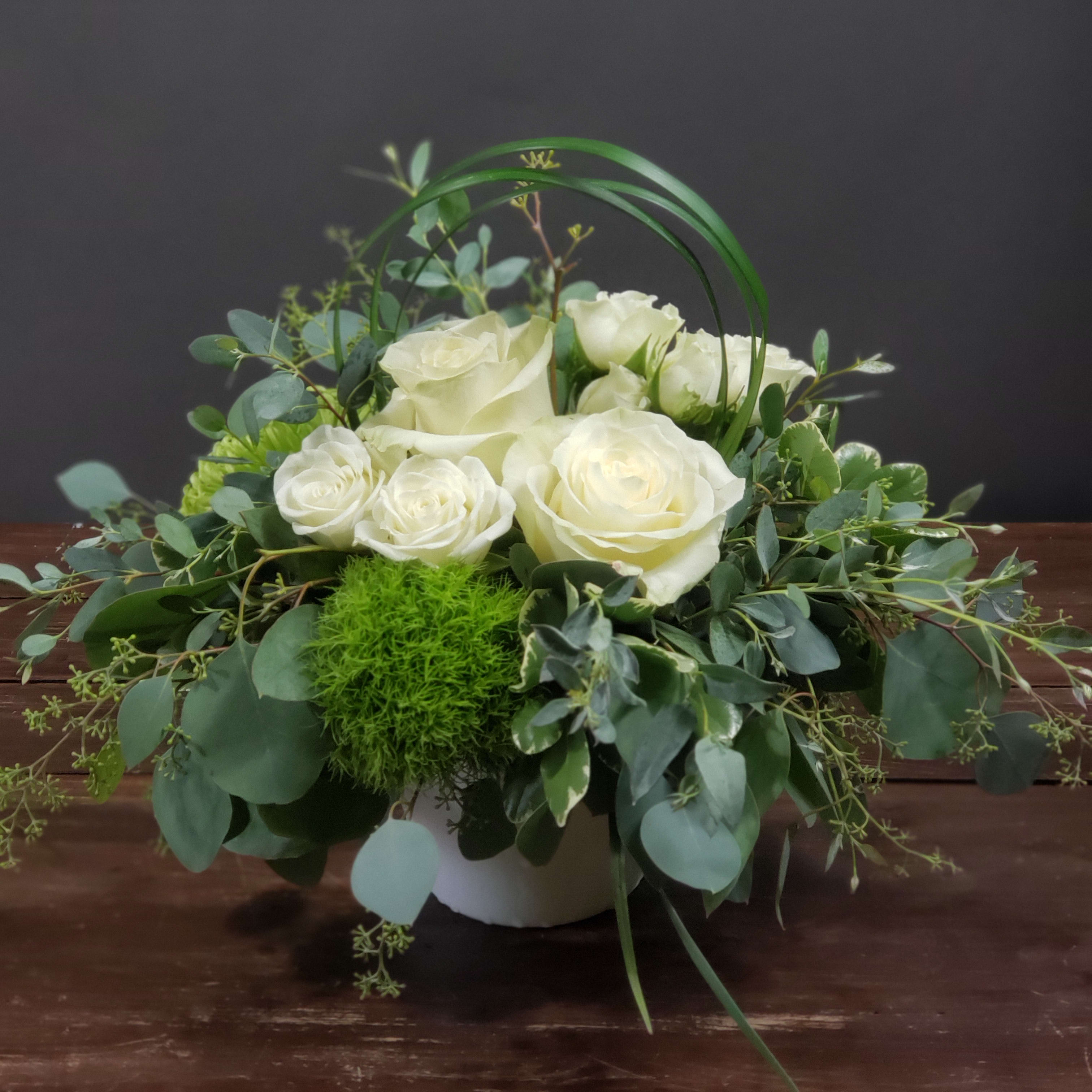 Serene Thoughts - These white roses with added greens are great to help calm the atmosphere and let someone know you're thinking of them.