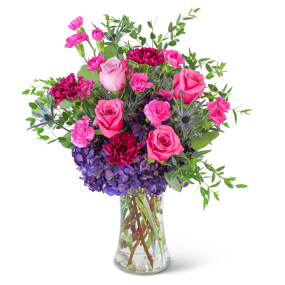 Love in London - Delight in the rich purple tones of one of our floral favorites, Love in London. A tall, chic vase with hydrangea, roses, carnations, and premium foliage makes up this beautiful floral design. This vibrant flower arrangement will brighten anyone's day and add a pop of color to any space. It would make a perfect Anniversary or Birthday gift for that special someone.