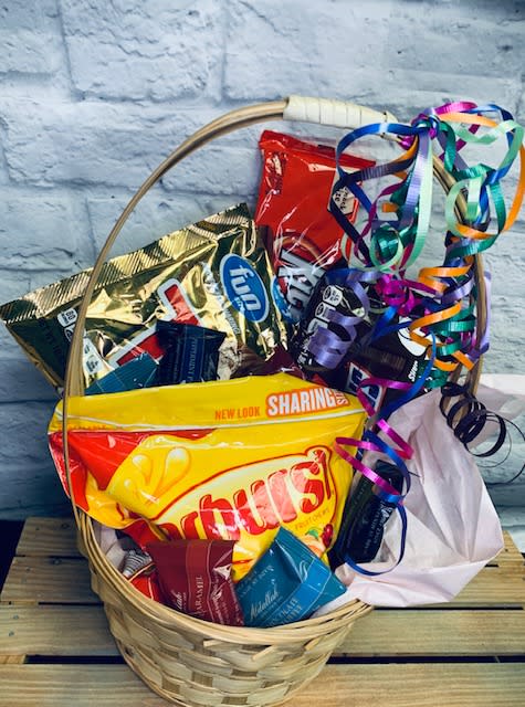 Candy Basket - Send your family and friends the sweetest gift basket out there! Let our designers create a sweet treat that is sure to satisfy all ages. Let us decide what goes in it or let us know what you'd like to see. **Basket shown is the deluxe.