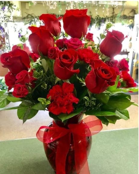 Be Mine Be Mine - Be mine.. All the time! This classic and beautiful combination is sure to win anyone's heart. Beautiful long lasting carnations and premium roses are a classic to remember.