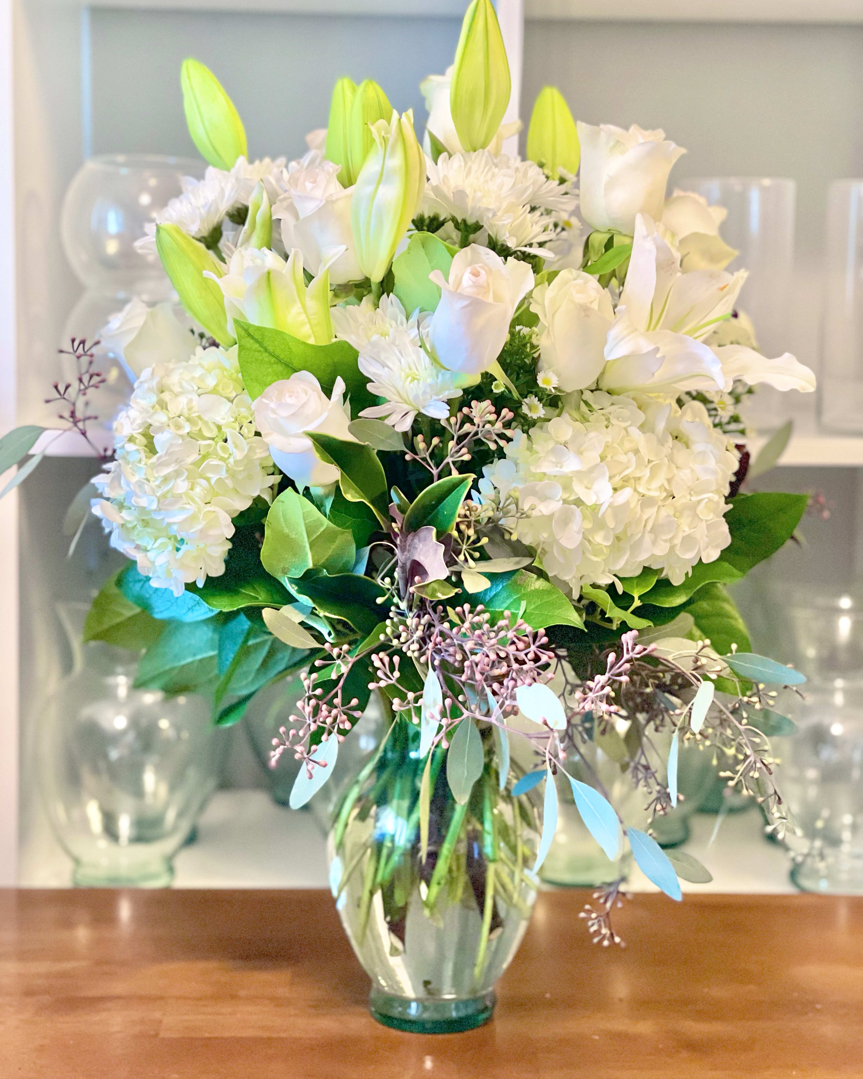 Always and Forever Always and Forever - All white arrangement with fresh blooms in a clear 8” vase. A classic way to show eternal love.