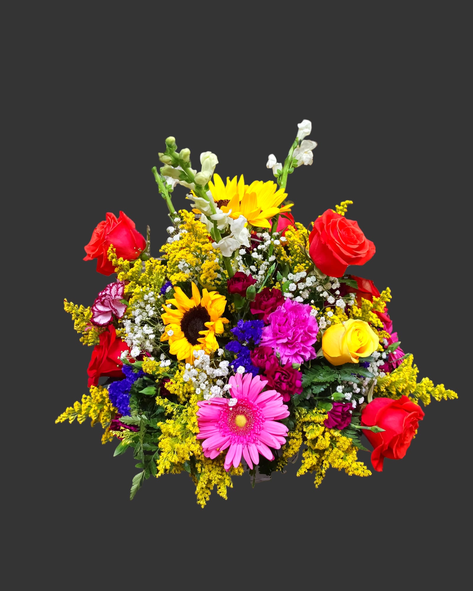 Nice mixed spring floral centerpiece - nice mix of spring flowers in a basket. Mix of sunflowers, white snapdragons, yellow solidago fillers, pink carnations, red roses, purple carnations,pink gerberas, purple statice, and baby's breath.