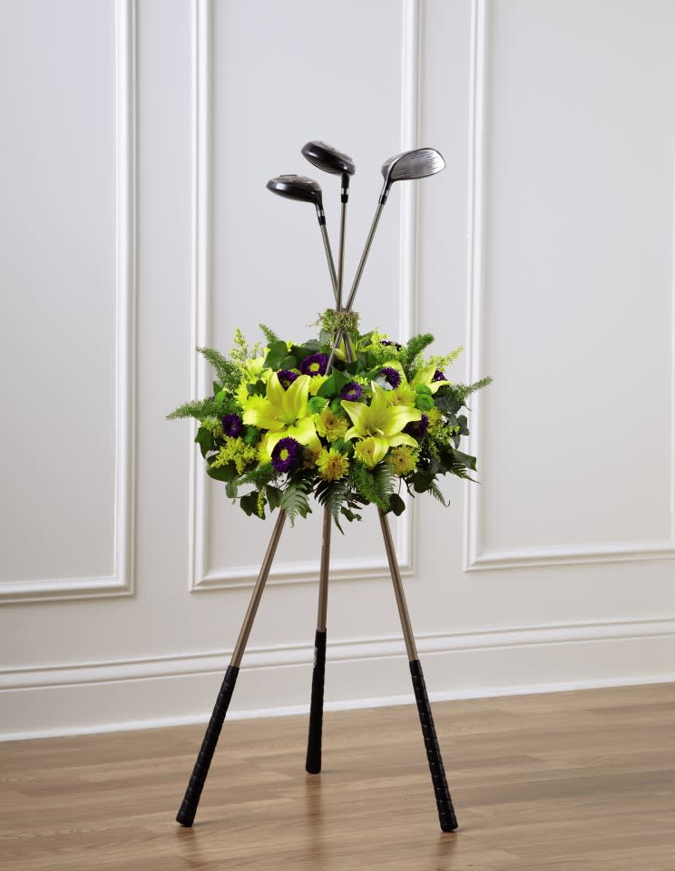 Golf Tribute - Perfect way to remember your favorite golfing partner. Just bring us some clubs and we'll design the free standing floral tribute using chrysanthemum poms, asters, and lilies. 