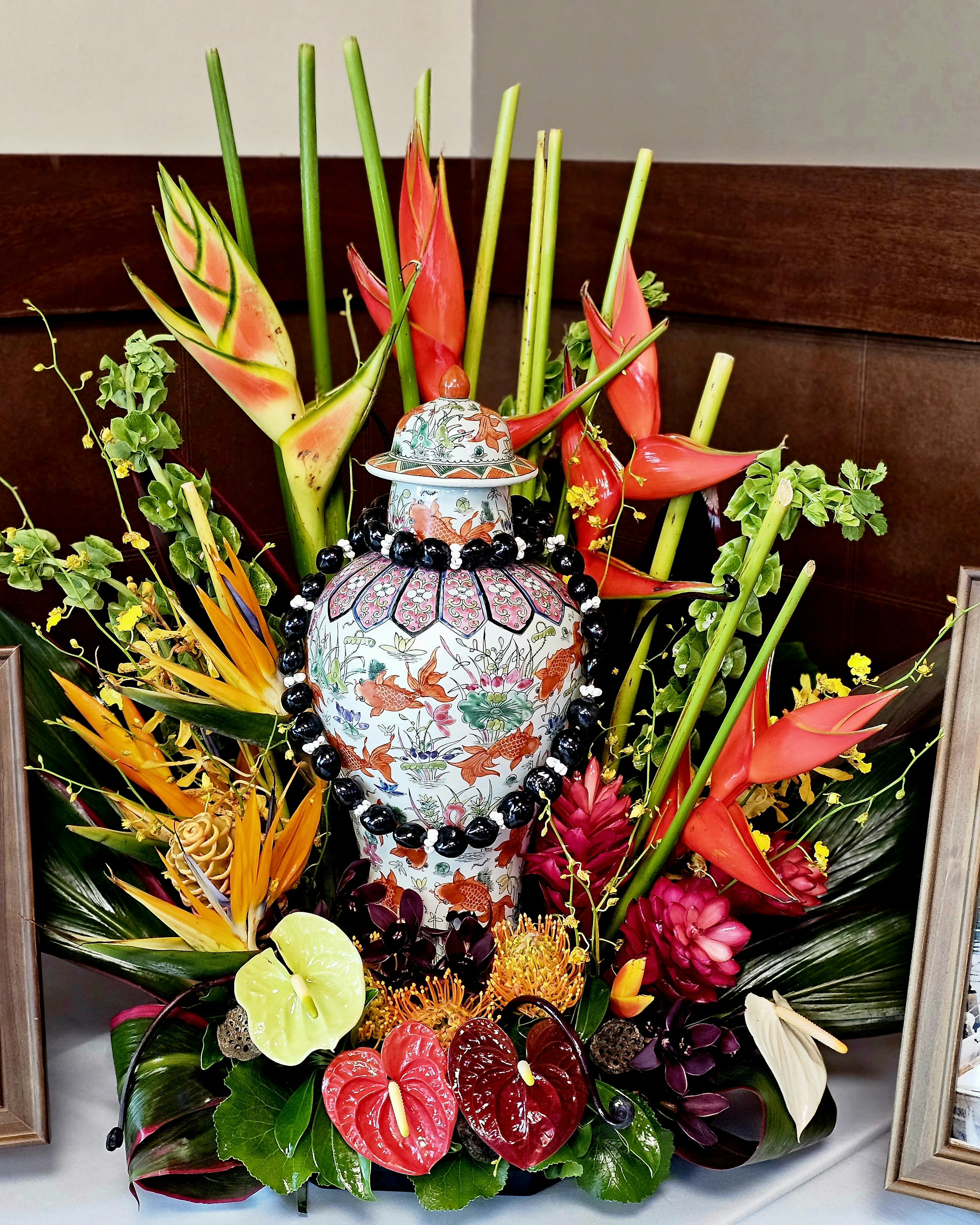 Custom Urn tropical spray  - We offer a customer tropical Urn display for your loved one who has passed. Please call us to discuss the options that you would like to have for your personal arrangement. 