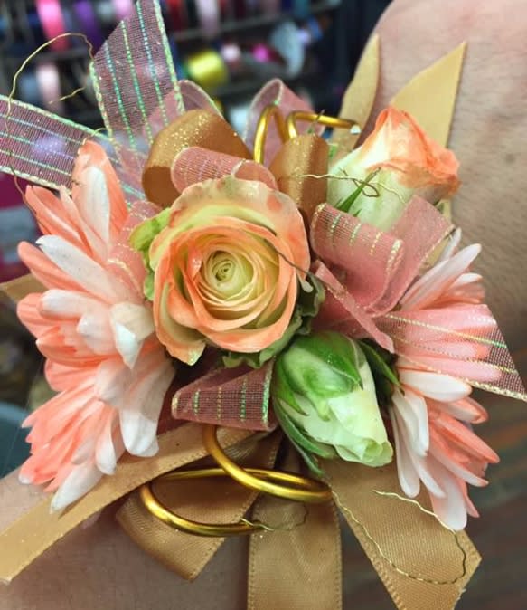 Gold and Coral Wrist Corsage - A wrist corsage with coral tipped flowers and accented with white rose buds. We've added gold ribbon and wire for extra bling!
