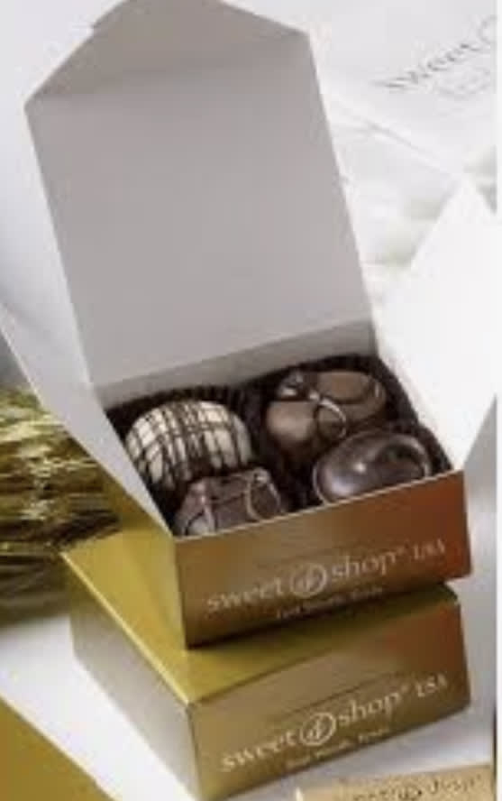 Boxed Four Sweet Shop USA Truffle - Sweet Shop USA makes all natural, handmade chocolate truffles for over 50 years. These are the large 1 1/2 ounce each, chocolate, satisfying truffles!! This box includes four of the larger size of Truffles come in many delicious varieties like the original Fudge Love, Red Velvet, Sea Salt Caramel, Sundae Bash and more!!! Truffles come in a beautiful gold box with the Sweet Shop USA logo.  