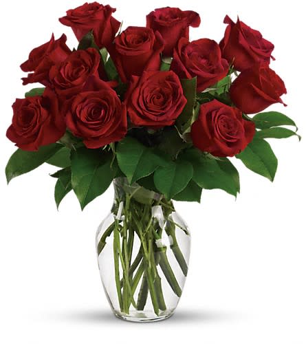 Enduring Passion - 12 Red Roses - A dozen red roses is a timeless gift of love and the time is always right to give and receive this enchanting gift. Birthday anniversary or just because the magic of roses will always cast its spell. You'll see. This romantic bouquet includes one dozen red roses accented with lush greenery. Delivered in a clear glass rose vase.Approximately 14 1/2&quot; W x 15 3/4&quot; H Orientation: All-Around As Shown : TEV12-7ADeluxe : TEV12-7BPremium : TEV12-7C