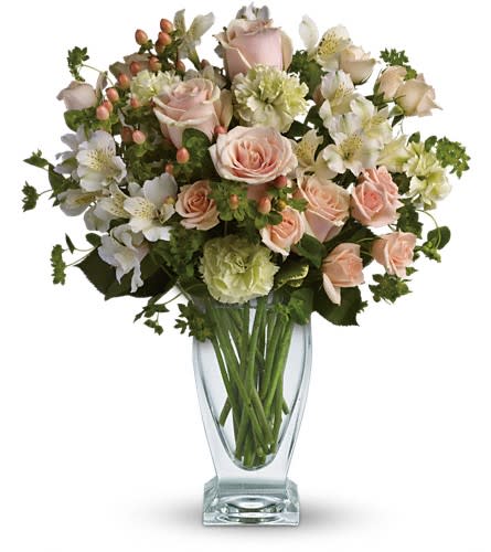 Anything for You by Teleflora - You'd do anything for her so let her know how you feel by sending this generous and gorgeous arrangement. Who could ask for anything more? Beautiful peach roses and spray roses white alstroemeria brilliant green carnations peach hypericum and fresh garden greens are perfectly hand-arranged in a feminine Couture Vase.Approximately 15 1/2&quot; W x 17 1/2&quot; H Orientation: All-Around As Shown : T67-1ADeluxe : T67-1BPremium : T67-1C