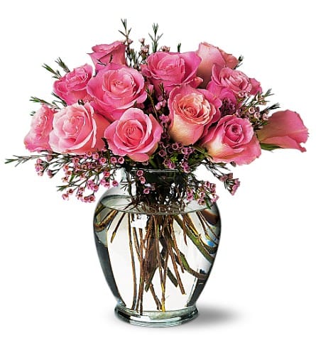 A Pretty Pink Dozen - Soft and lovely perhaps they're just like that special someone you're thinking of. Twelve roses with waxflower in a classic glass vase.Approximately 12-1/2&quot; W x 13&quot; H Orientation: All-Around As Shown : TF32-3