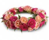 Queen's Garden Crown - She'll feel like royalty in this gorgeous crown of pink roses. A crown of pink and hot pink roses with accents of seeded eucalyptus and Italian ruscus.Approximately 25&quot; W x 3 1/2&quot; H Orientation: N/A As Shown : T193-5A