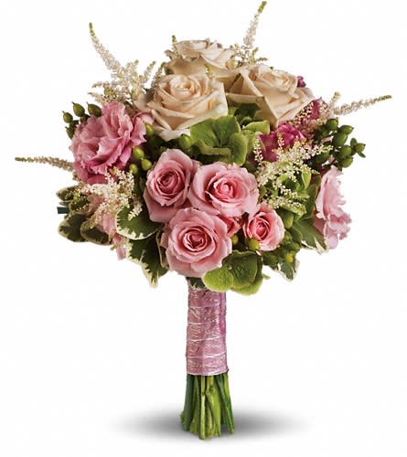 Rose Meadow Bouquet - Like a romantic walk through a meadow of roses this heartwarming bouquet pairs soft pink with fresh green. A lovely ensemble of pink roses white astilbe green hypericum and hydrangea with variegated pittosporum.Approximately 11&quot; W x 14&quot; H Orientation: N/A As Shown : T191-1A