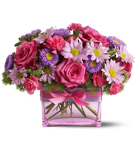 Teleflora's Favorite Things - This beautiful bouquet is created from some of our favorite pink and purple things - roses mixed blossoms and a striking glass vase in a matching shade of pink decorated with pink and purple ribbons. Send this glamorous gift to someone special. It's sure to make them smile! A mix of fresh flowers such as roses miniature carnations chrysanthemums and asters ? in shades of pink and lavender ? is arranged in a Teleflora rectangular pink glass vase decorated with hot pink and purple satin ribbons. Approximately 12&quot; (W) x 9&quot; (H) Orientation: All-Around As Shown : TFWEB328