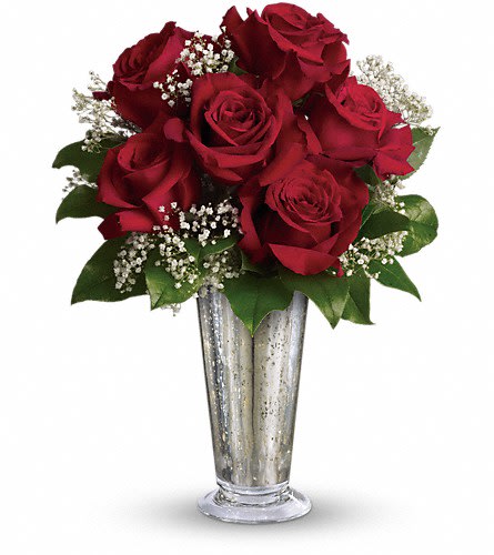 Teleflora's Kiss of the Rose - True love. Sweet love. Beautiful love. Celebrate all flavors of love with this elegant arrangement of roses hand-delivered in a stunning silver Mercury Glass Vase. Six ravishing red roses mixed with gypsophila and greens are arranged in a Mercury Glass Antique vase. Send this kiss of bliss!Approximately 11&quot; W x 15&quot; H Orientation: All-Around As Shown : T65-3ADeluxe : T65-3BPremium : T65-3C