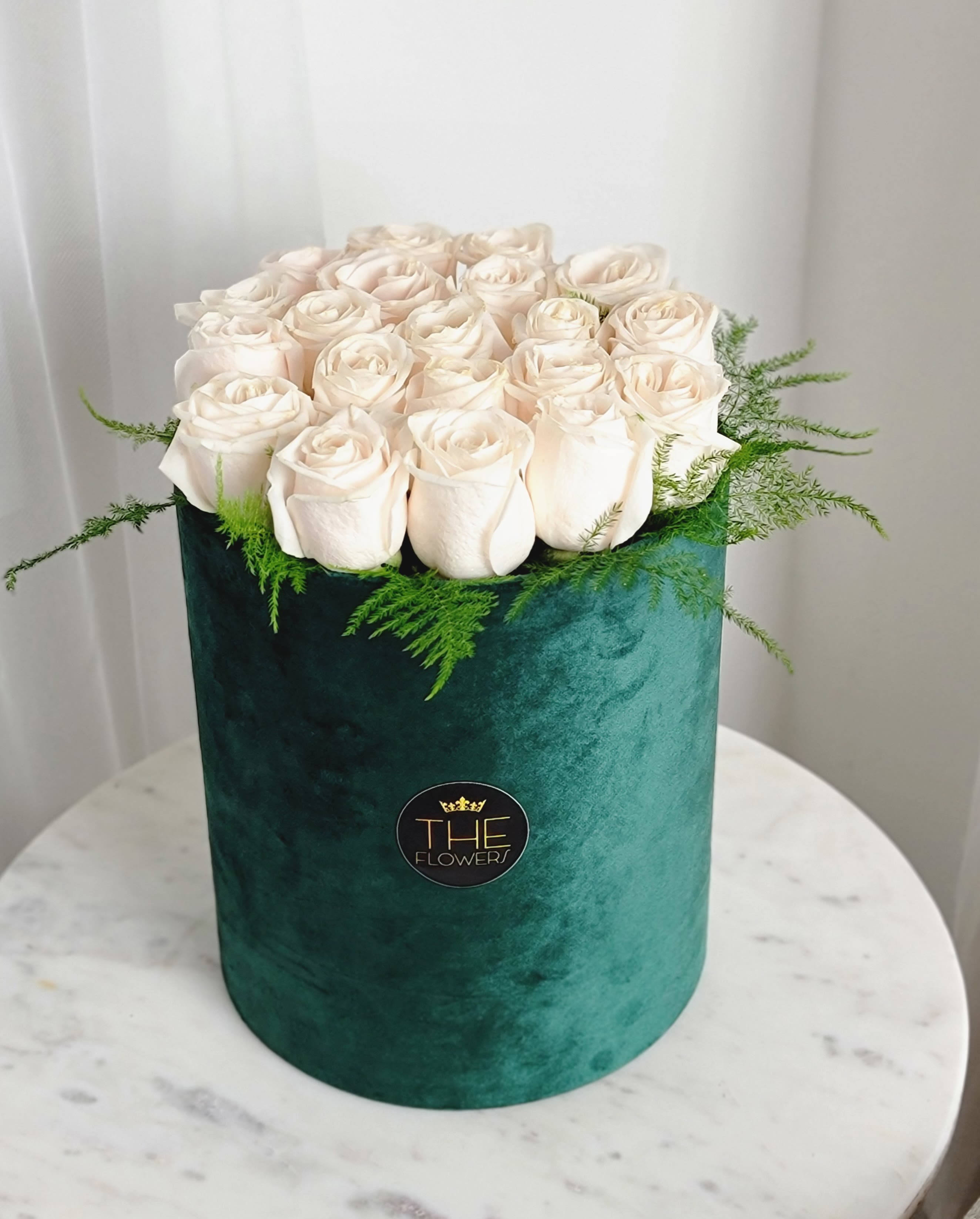 Love Letter  - Our luxury box of white roses is a win-win option as all women love white roses. Touched along the edges with delicate greenery, it gives the roses even more freshness. Do not forget to water the flowers every day and they will delight you for a long time.