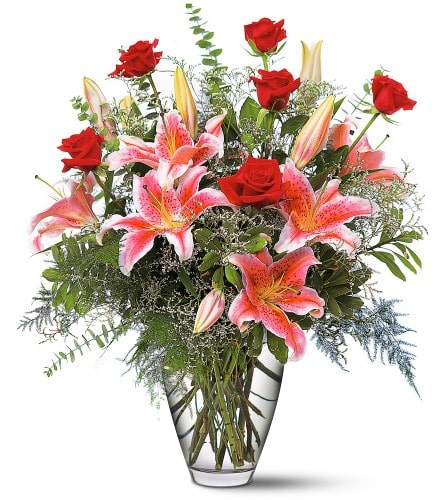 Celebrations Bouquet - This romantic arrangement of stargazer lilies and red roses will help to celebrate any occasion with style. Stargazer lilies roses and eucalyptus arrive in a clear glass vase. Approximately 23&quot; W x 26-1/2&quot; H Orientation: One-Sided As Shown : TF115-1