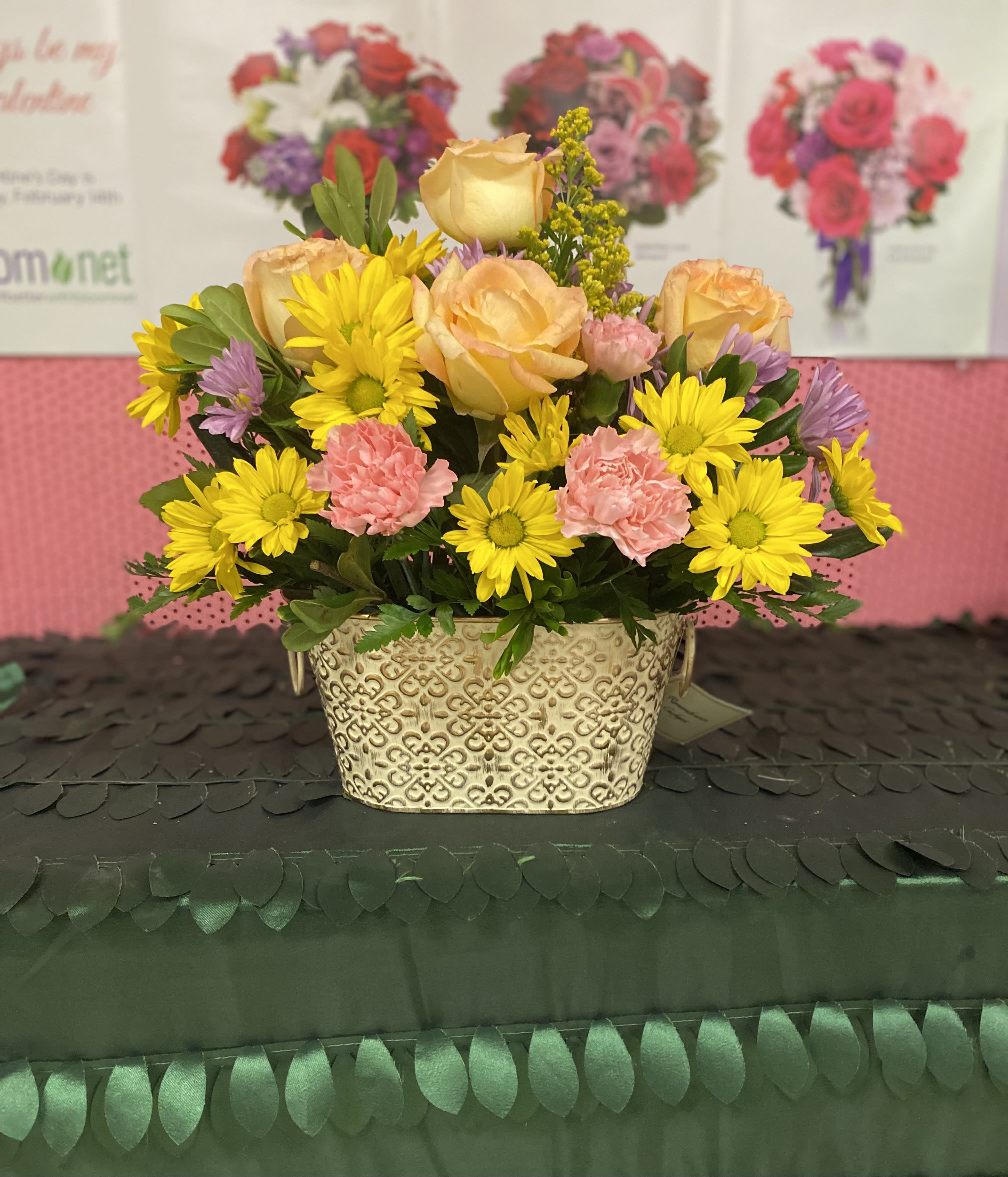 Colors in Tin can Colors in Tin can - A beautiful arrange of soft colored florals arranged in a keepsake tin!