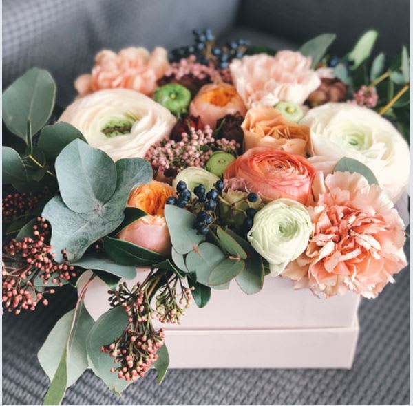 Peach surprise Peach surprise - Monochromatic floral arrangement in shades of peach that includes an assortment of ranunculus, carnations, filler, and greens.