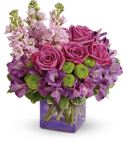 Teleflora's Sweet Sachet Bouquet - Sweet as can be! Hand-delivered in a chic lavender cube this marvelous mix of jewel toned blooms is a touching way to celebrate someone special on their birthday or any day. Lavender roses purple alstroemeria light pink stock and green button spray chrysanthemums are accented with variegated pittosporum. Delivered in a lavender cube vase. Approximately 12&quot; W x 13 1/2&quot; H Orientation: All-Around As Shown : T600-9ADeluxe : T600-9BPremium : T600-9C