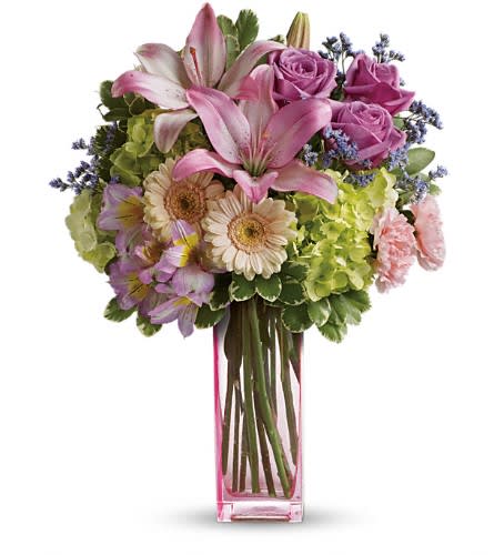 Teleflora's Artfully Yours Bouquet - Sweep her off her feet say Happy Birthday or simply brighten an ordinary day with the breathtaking beauty of this luxurious arrangement. Hand-delivered in a gorgeous pink glass vase this mix of hydrangea roses lilies and gerberas is a gift she'll never forget! Surprise them with this bouquet of green hydrangea lavender roses crème spray roses pink asiatic lilies miniature peach gerberas pink alstroemeria light pink carnations lavender limonium and variegated pittosporum. Delivered in a pink vase.Approximately 14&quot; W x 18&quot; H Orientation: One-Sided As Shown : TEV40-1ADeluxe : TEV40-1BPremium : TEV40-1C