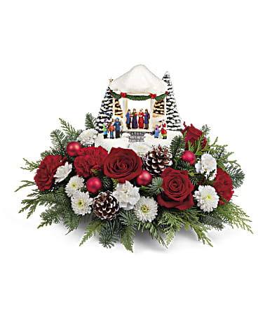 Thomas Kinkade's Singalong Bouquet - Sure to make everyone merry, this charming Thomas Kinkade caroling scene features hand-painted details and glowing lights. The Christmas collectible is surrounded with festive roses and blooms. This bouquet includes red roses, red carnations, miniature white carnations, white cushion spray chrysanthemums, cedar and noble fir. Delivered with a Thomas Kinkade's Sweet Sounds of Christmas Keepsake.