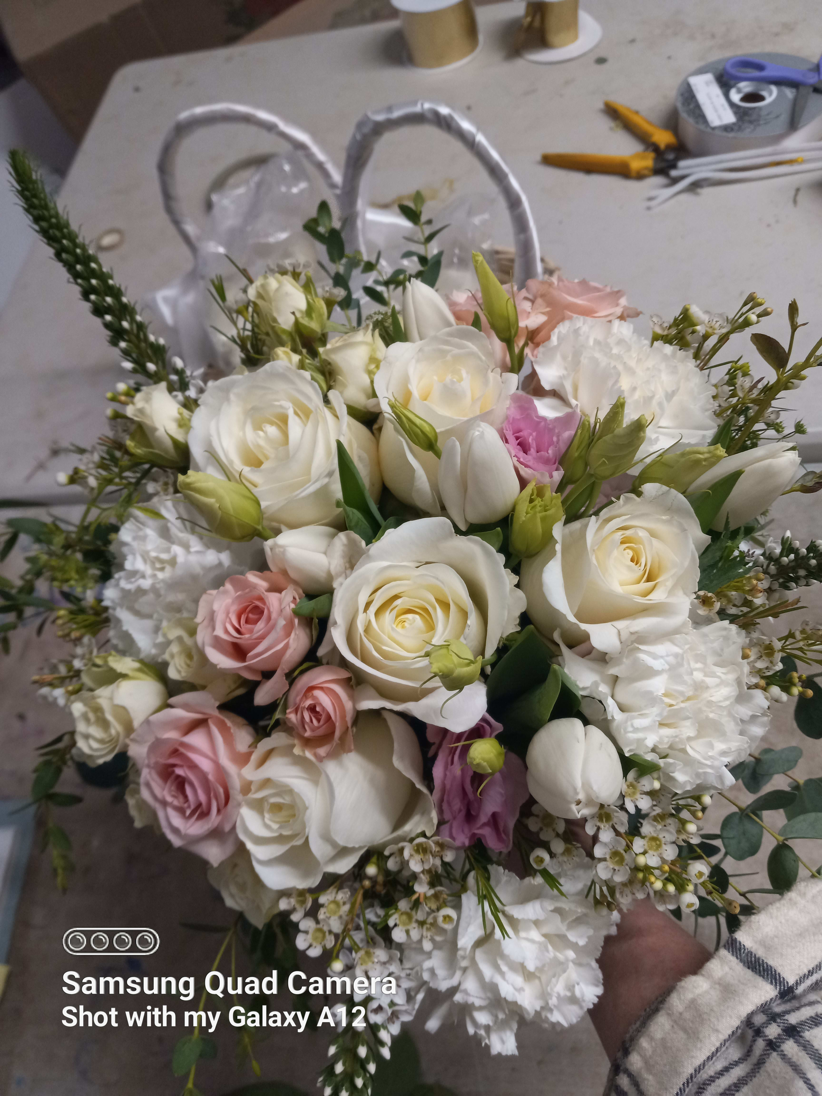 Pure sweet bouquet  - Beautiful white standard roses, pink spray roses, white tulips and white wax flower in a classical round bouquet