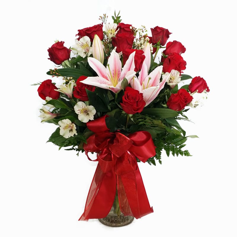 1 dozen red roses with lilies, alstroemeria and snapdragons B 1 dozen red roses with lilies, alstroemeria and snapdragons B - This stunning arrangement says,"I Love You" for Valentine's Day!