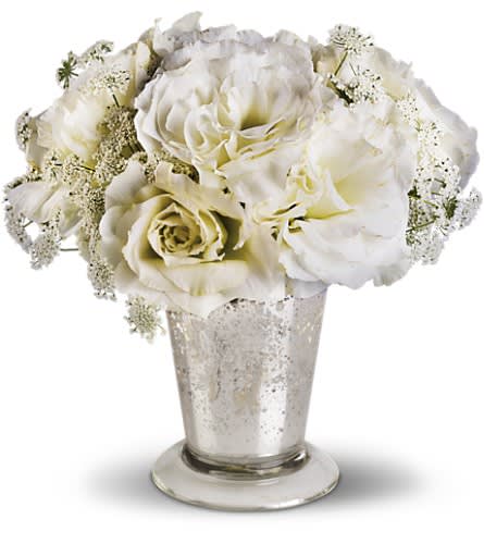 Teleflora's Angel Centerpiece - A petite expression of elegance this angelic centerpiece pairs airy Queen Anne's lace with delicate lisianthus in an antiqued Mercury Glass Vase. A Mercury Glass Antique Vase holds Queen Anne's lace and lisianthus.Approximately 8&quot; W x 8&quot; H Orientation: All-Around As Shown : T189-2A