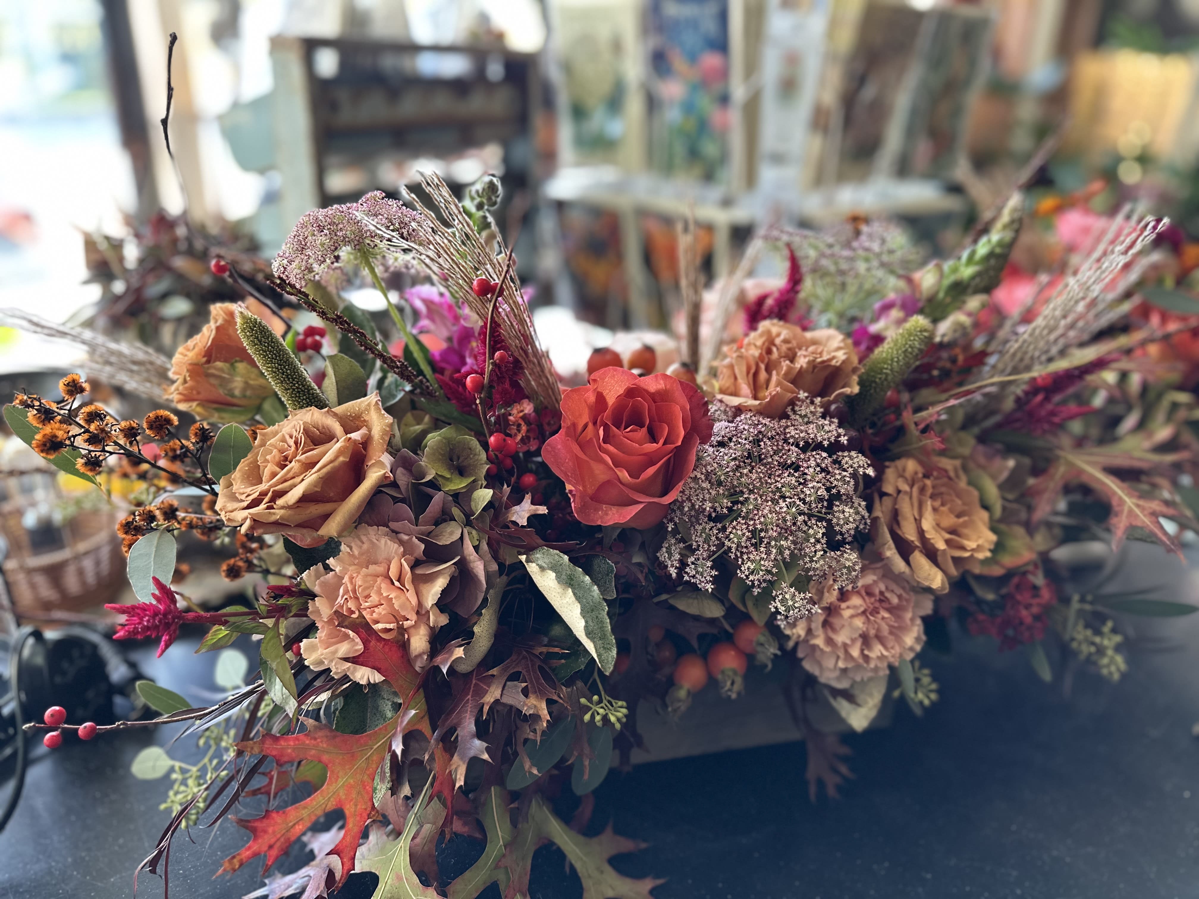 Fall Seasonal Box Arrangements for your table Fall Seasonal Box Arrangements for your table - These wooden boxes are filled with seasonal florals and greenery in a variety of colors. This long and low design is perfect for your table!