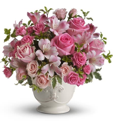 Teleflora's Pink Potpourri Bouquet with Roses - As strong as it is soft the color pink as it is featured here creates a loving and utterly feminine tribute. Many shades of pink blossoms blend together for an effect that is beautifully subtle and sublime. A range of lovely flowers like pink roses spray roses and alstroemeria are accented by fresh greens in the loveliest way and delivered in a beautiful French Country Pot.Approximately 13&quot; W x 12 1/2&quot; H Orientation: All-Around As Shown : T210-1ADeluxe : T210-1BPremium : T210-1C