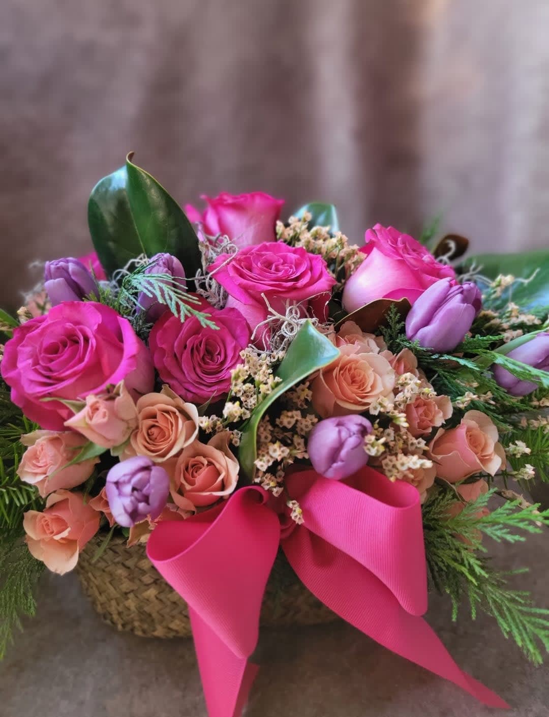 Cheers To The Holidays - Roses, Tulips, and Pine leaves, in a decorated woven basket
