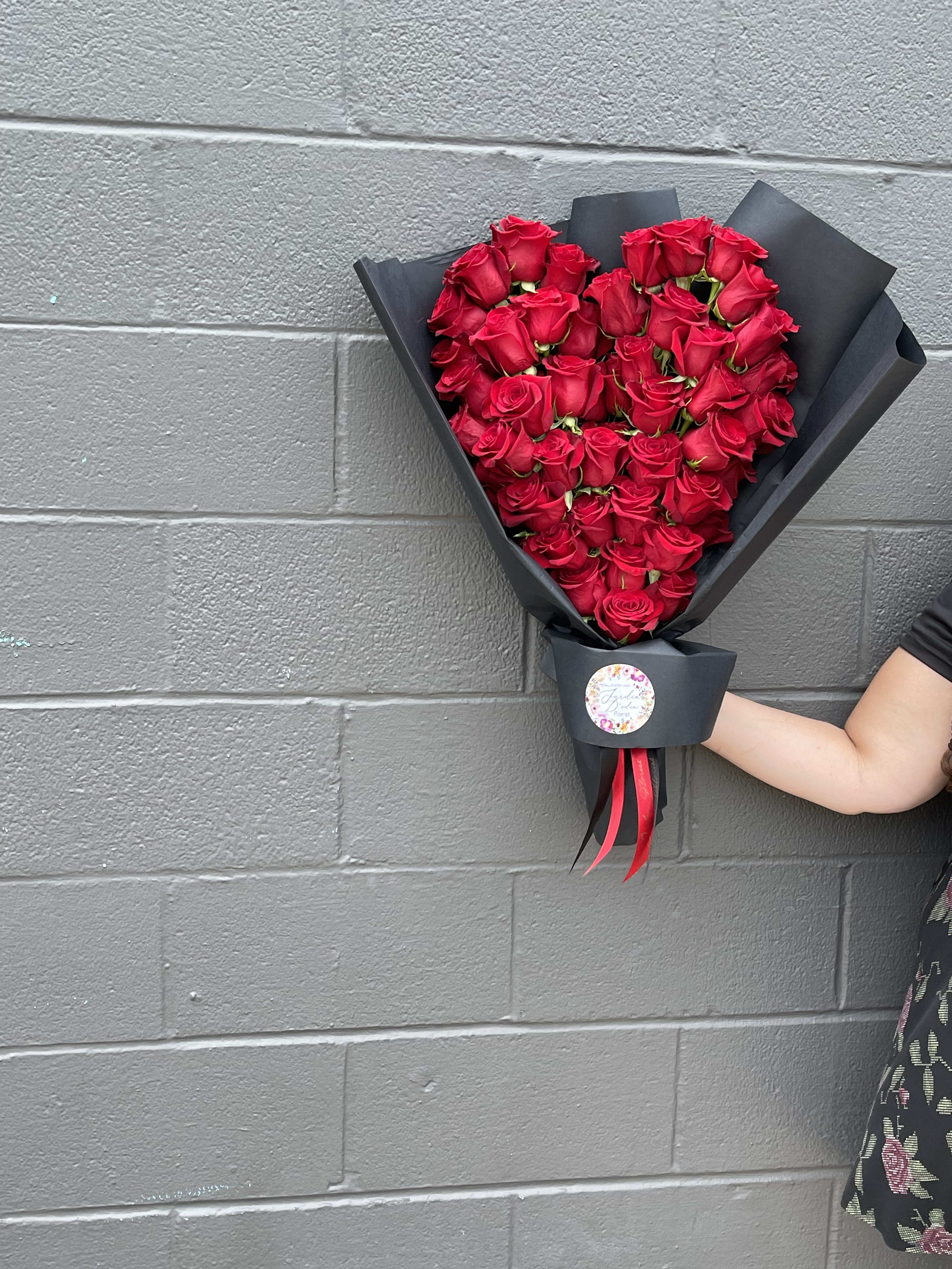 The Romantic Heart Bouquet The Romantic Heart Bouquet - This beautiful heart shape bouquet is created with 50 long stem roses and carefully wrapped in korean wrap paper