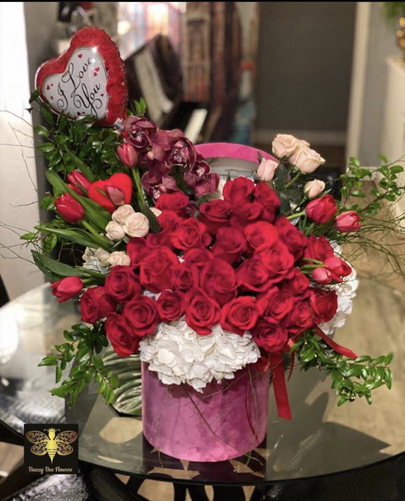 My Sweet Valentine - Silver Lake Florist - This beautiful arrangement is designed to deliver happiness to a loved ones day. Filled with beautiful flowers and customized to perfection, this arrangement is a showstopper! If you want to turn heads then this is the arrangement for you! This is for that special someone!