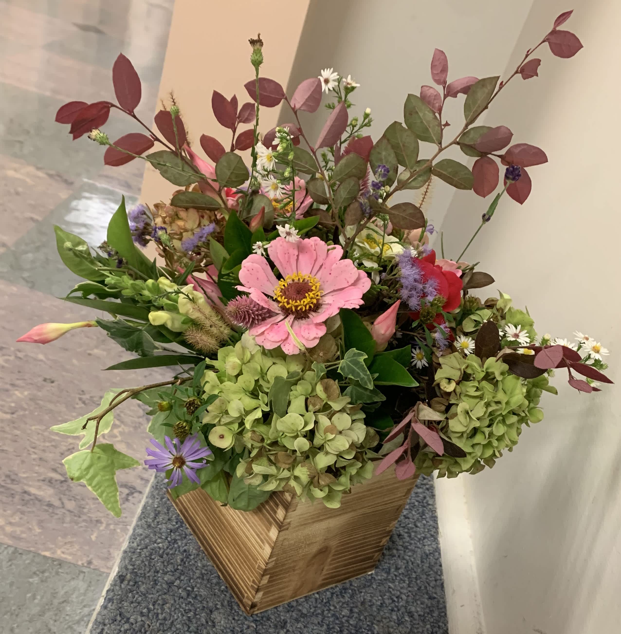 Rustic mixed bouquet - Mixed seasonal blooms in a wooden rustic vase