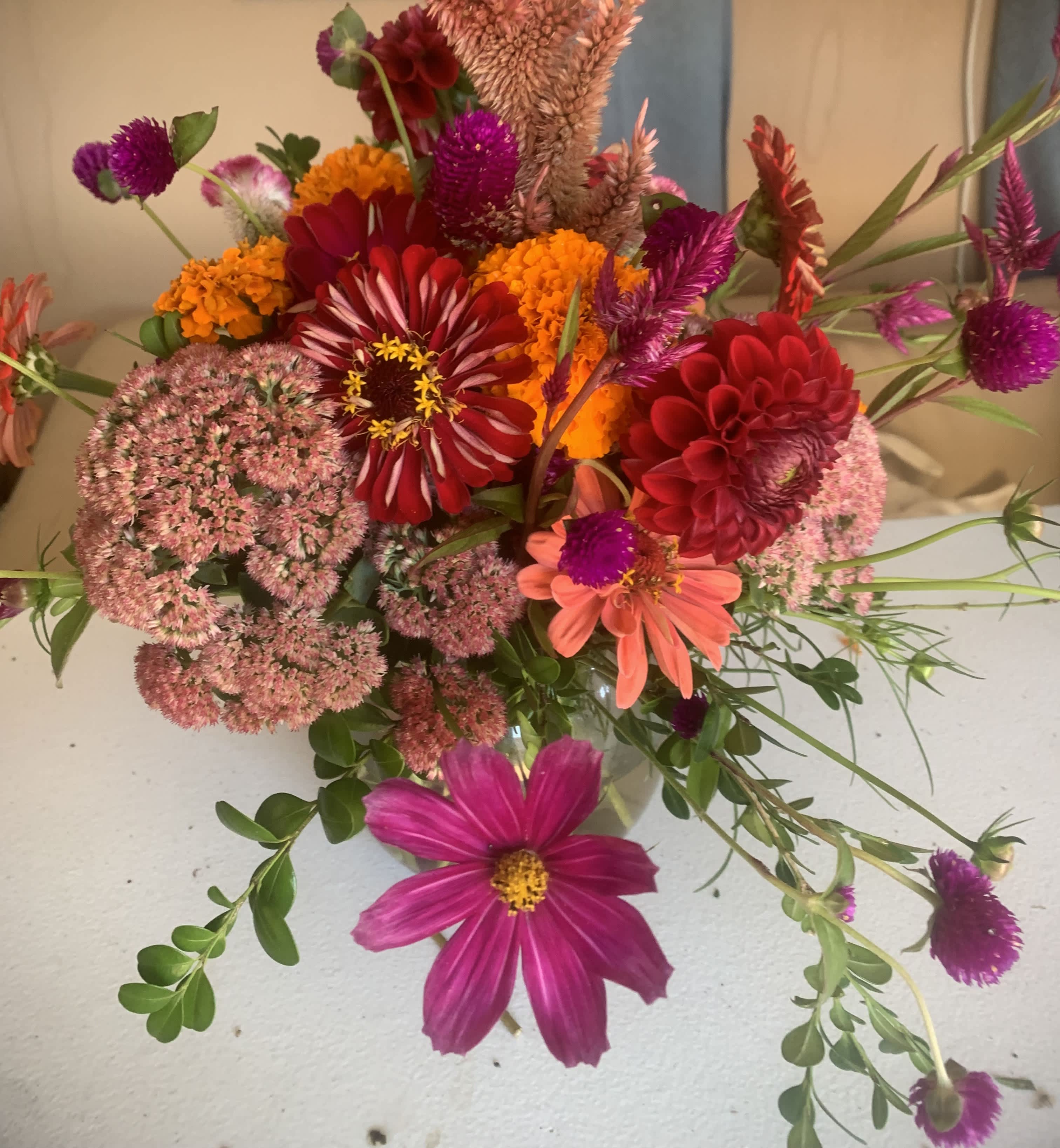 Summer joy - Locally grown seasonal blooms of sedum, red and orange zinnias and cosmos