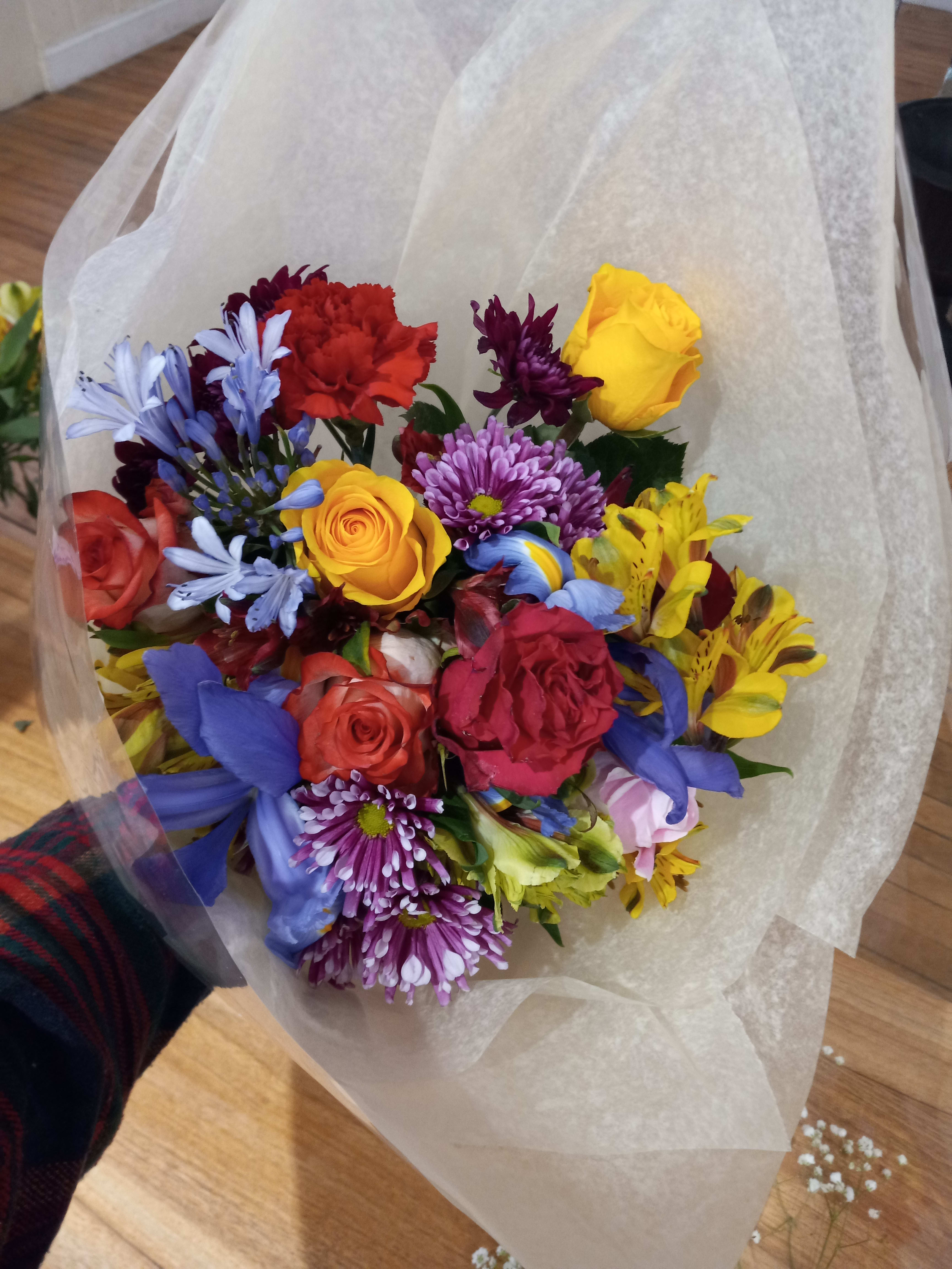 Gallina - Cheerful bright mix of roses and other flowers in hand tied bouquet  