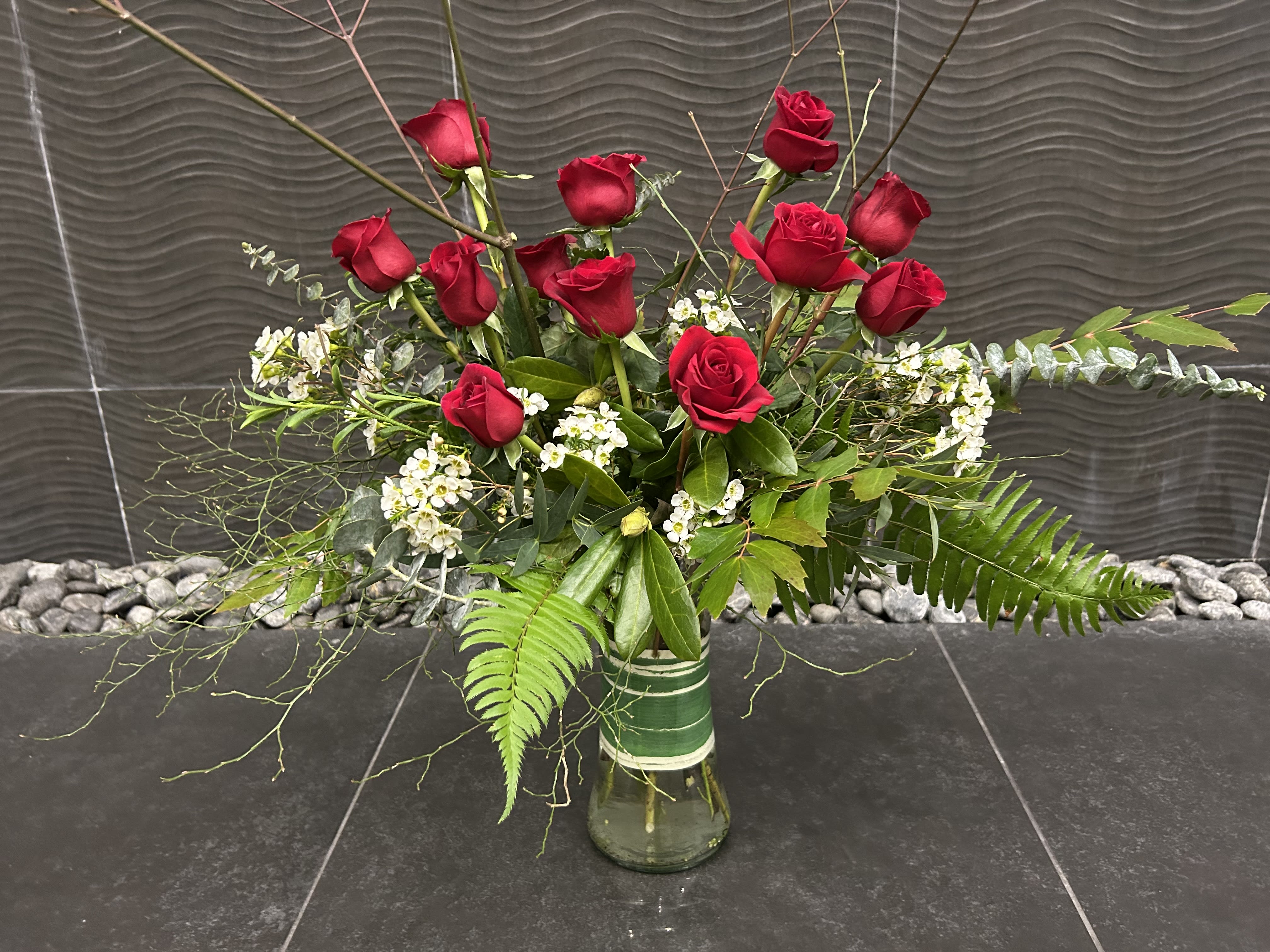 Forever Love - Our take on a traditional design of a dozen long stem Red Roses. Deluxe is 18 Roses, Premium is 24.