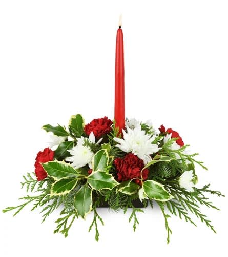 Truly Christmas Centerpiece Truly Christmas Centerpiece - Nothing says “Happy Holidays!” better than this festive red and white centerpiece. Choose it as the perfect finishing touch for your own holiday table, or send it to a loved one who can’t get enough of this joyful season. Red carnations, white mums, and fragrant greens are arranged with a red tapered candle.