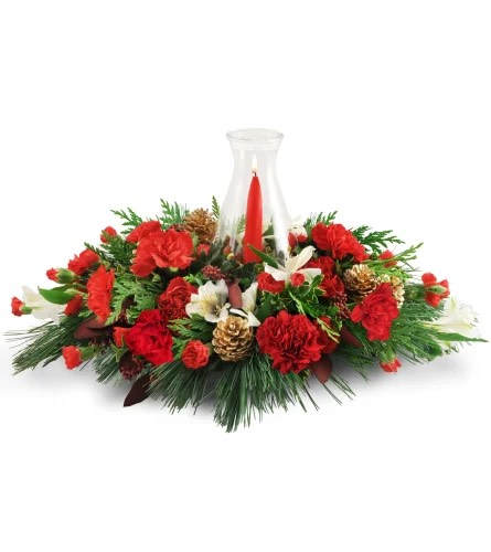 Warming Glow Centerpiece Warming Glow Centerpiece - Ready to kick off the holiday season? Add a warm, welcoming glow to a loved one’s home (or your own!) with this artfully arranged centerpiece. Carnations, alstroemeria, pinecones, cedar, and more are topped with a taper candle in a delicate hurricane glass.