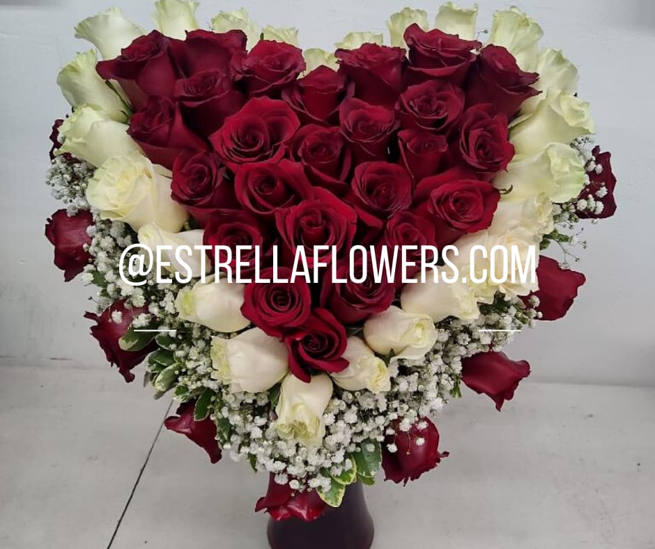 HEART OF ROSES HEART OF ROSES - INCLUDES WHITE ROSES AND RED ROSES . BABY BREATH WITH GREENERY