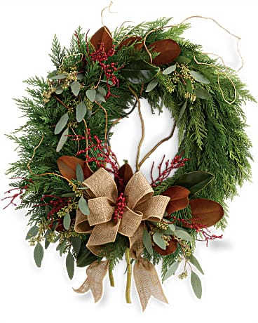 Rustic Holiday Wreath - Capture the rustic beauty of the winter forest with this wondrous flat cedar wreath, dressed up for the holidays with burlap ribbon and a spray of red Christmas berries! This wondrous wreath includes flat cedar, curly willow, seeded eucalyptus, and magnolia leaves.