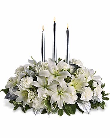 Silver Elegance Centerpiece - This silvery centerpiece is so elegant it practically speaks for itself. Perfect for a Christmas, New Year's or any other winter gala, its shimmery sophistication will light up the room. Beautiful winter white hydrangea, roses, asiatic lilies, carnations and greens surround three exquisite silver taper candles. It's as graceful as it is grand.