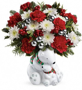 Polar Bear Hugs Bouquet Polar Bear Hugs Bouquet - Warm hearts with this adorable hugging polar bear pair! Holiday favorites including red carnations, silver ornaments and holly add a festive touch to any room in the house. Flowers are Carnations, Red, Chrysanthemums, Cushion Spray, White, Flat Cedar, Branch Holly, Variegated, Branch Noble Fir, Berry Spray, Red, Each Mm Ornament Balls, Silver, Local Wholesaler, Block, Send A Hug Cuddle Bears Keepsake.
