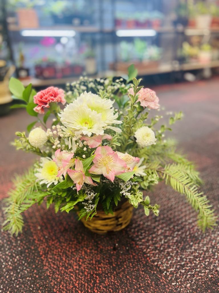 Pink Flower Arrangments - Celebrate fall with this stunning mix of warm autumn blooms  arranged in a basket. This unique bouquet includes pink alstroemeria, white button spray chrysanthemums, white disbud chrysanthemums, pink carnations with greenery. 