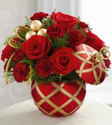 Season's greeting christmas ball Season's greeting christmas ball - Ornament design may vary due to availability. Shop will call in advance to verify the ornament needed. Value or design will not be affected in price or quality. The FTD® Season's Greetings™ Bouquet is an expression of holiday elegance set to send your warmest wishes for a wonderful winter season. Red roses and burgundy mini carnations create an exquisite arrangement accented with lush holiday greens, gold glass balls and gold cording. Arriving in a red ornament inspired ceramic container featuring a gold harlequin pattern with lid included, this arrangement is the perfect gift for any of the treasured friends, family and coworkers on your list. Item # 12-c5