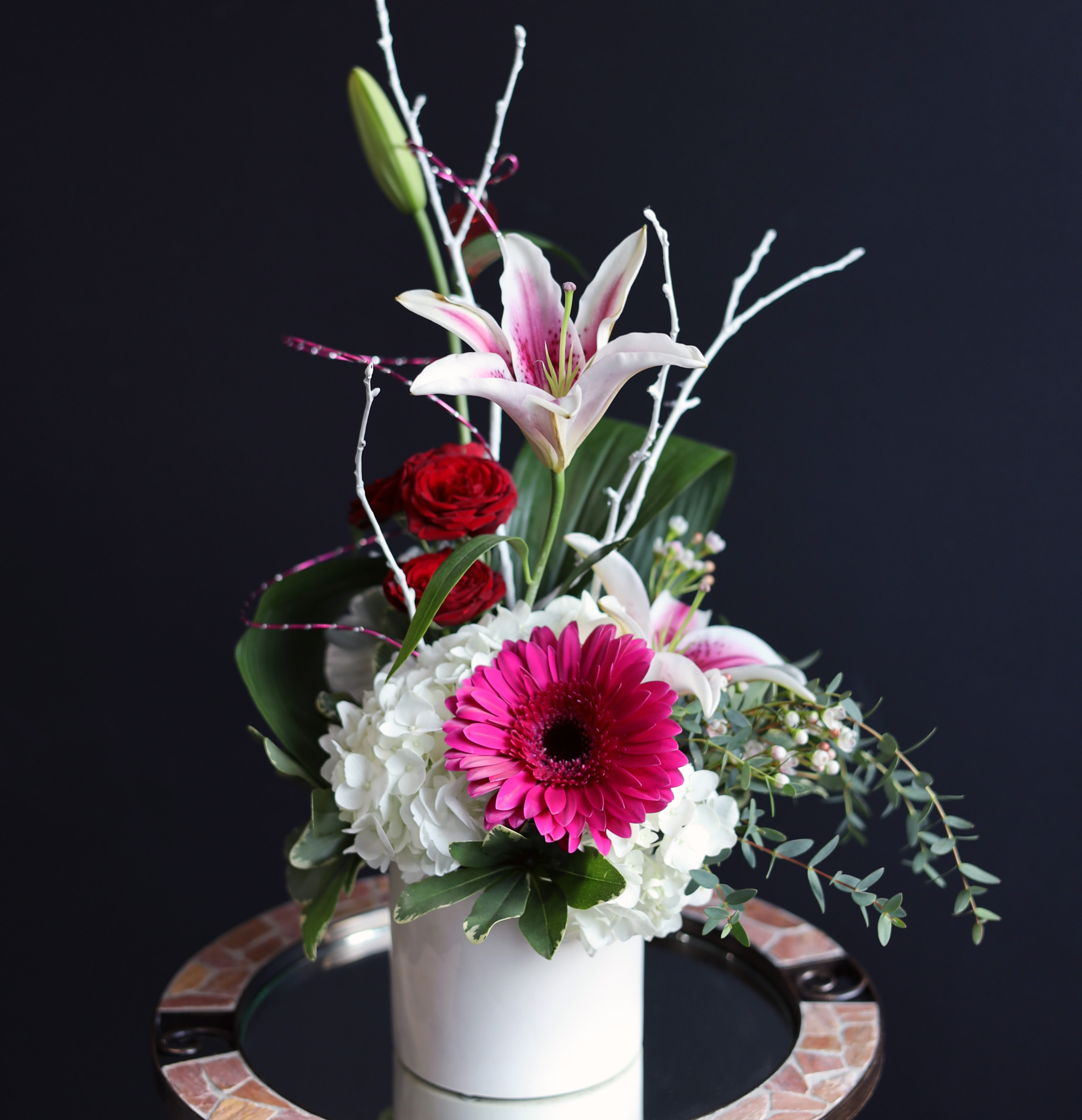 Divine - Starfighter Lily, Gerbera Daisy, Hydrangea, Spray Roses, and more varieties of floral stems designed together for an artistically divine look!