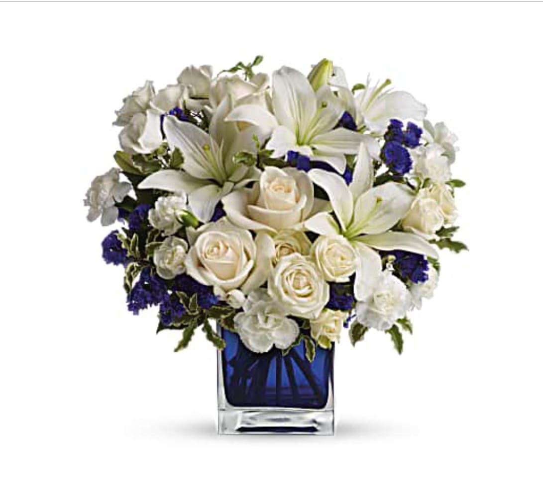 Sapphire Skies Bouquet by Teleflora TEV25-3B Sapphire Skies Bouquet by Teleflora TEV25-3B - Beautiful white and blue arrangement perfect for any occasion