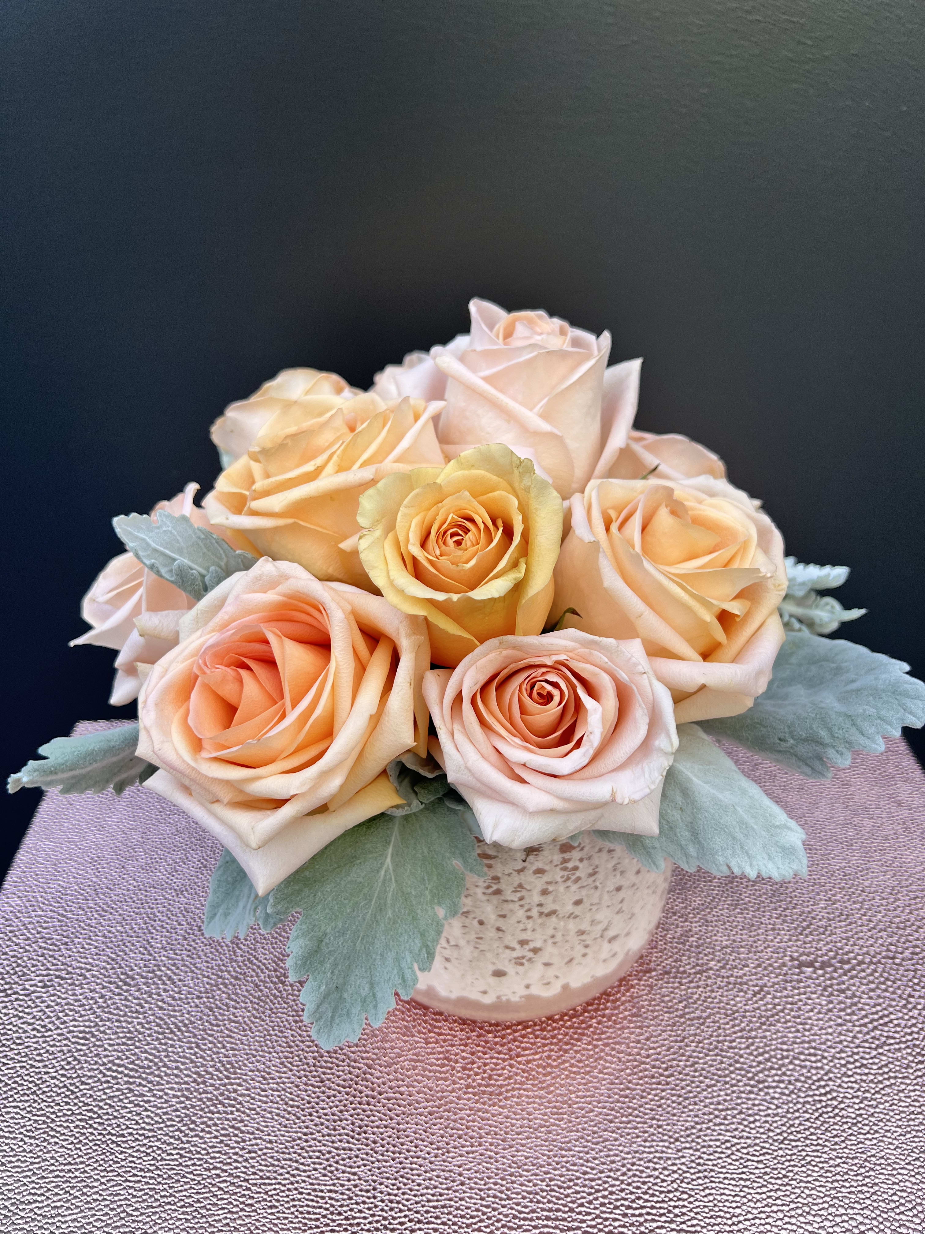 Euphoria  - Peach roses are delicate yet charming, making this arrangement elegant and breathe-taking.  