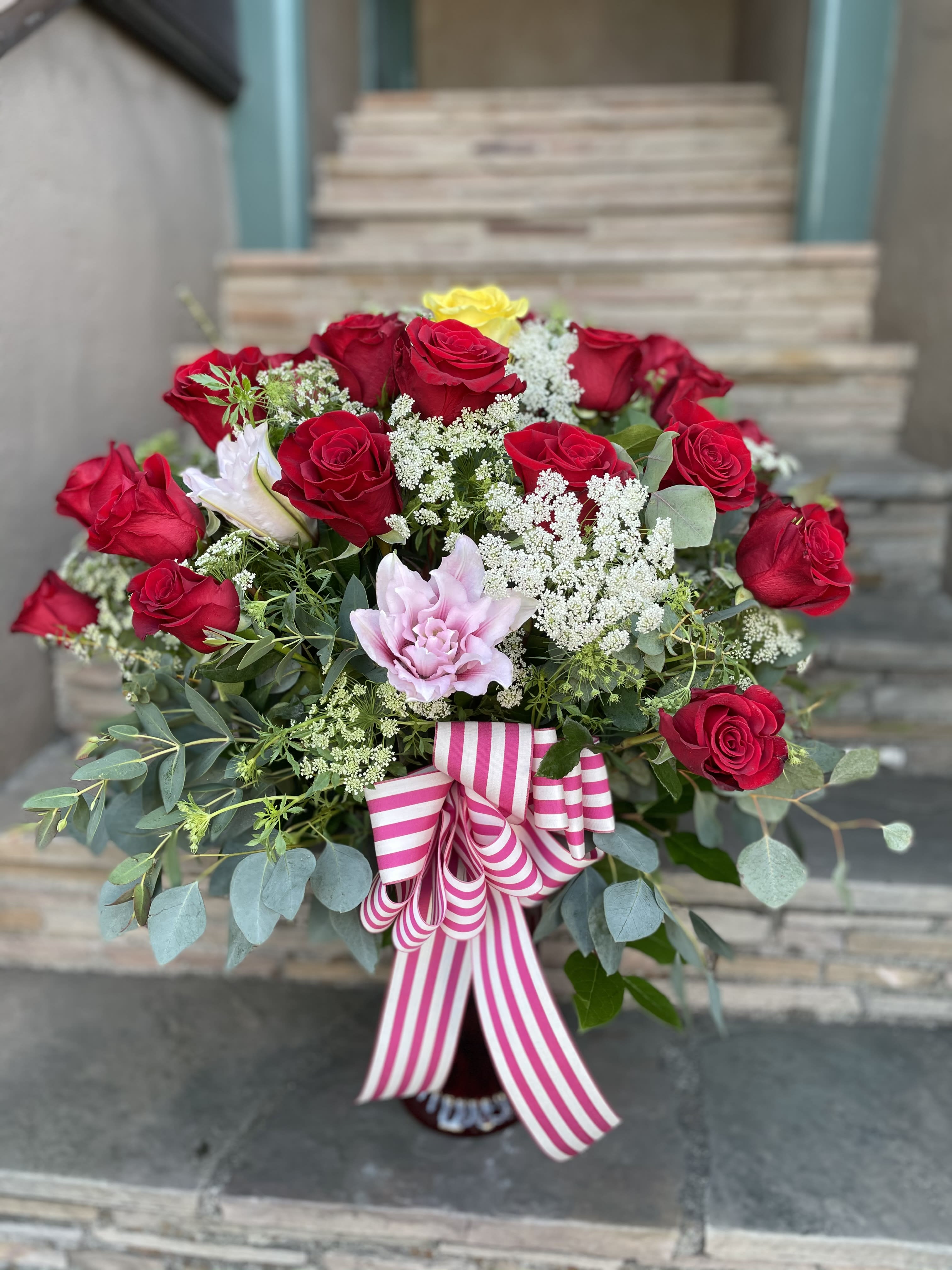 2 Red roses with Oriental Lilies 2 Red roses with Oriental Lilies - send someone special with this special arrangement. All around
