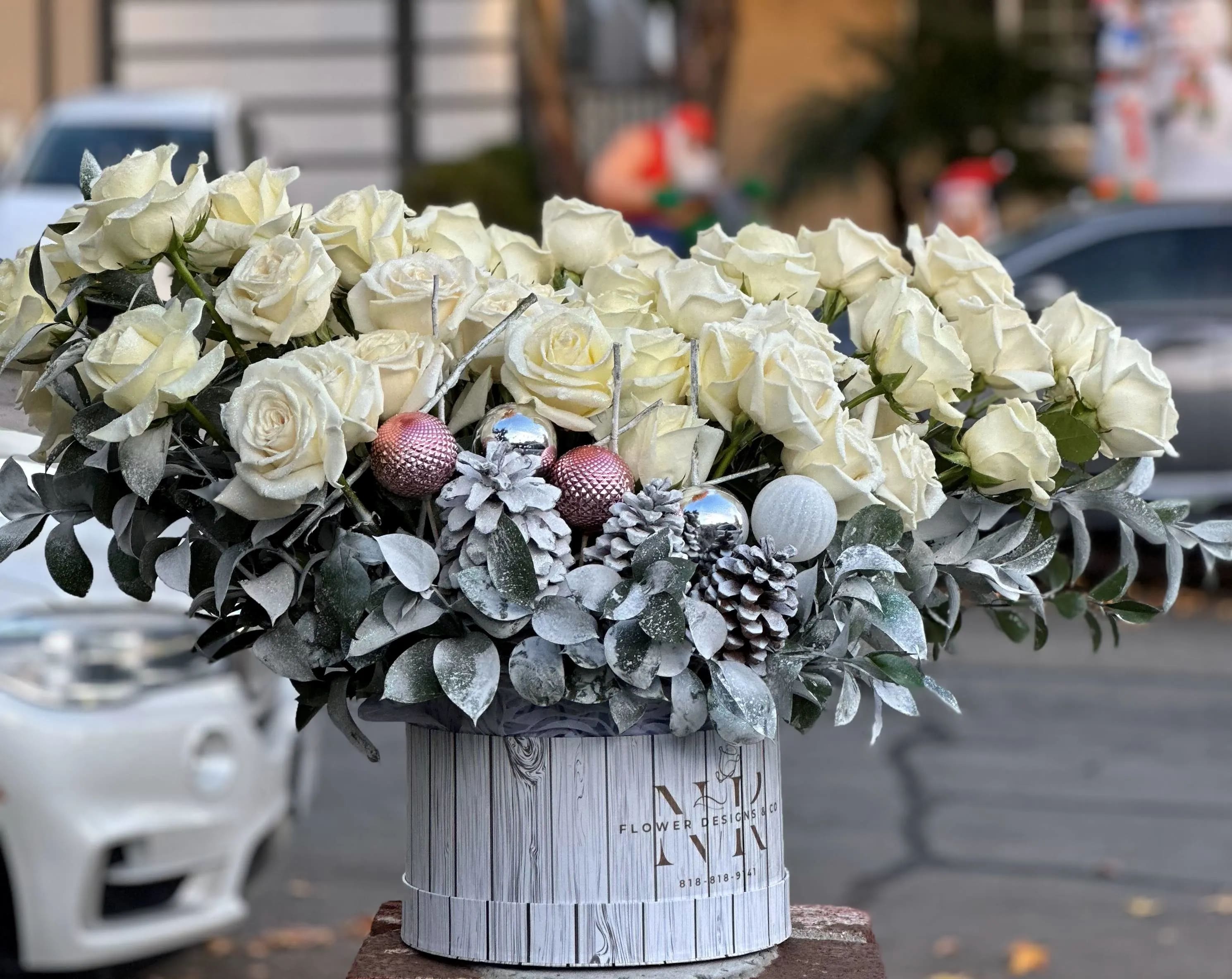 White Sparkly Roses for Winter Magic! - This holiday arrangement is designed with 50 white roses with a sparkly touch on the petals, hand made details and ornaments!